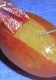 Close-up of a vibrant grape with a rip cut, showcasing its juicy interior ready for tasting or culinary use.
