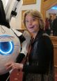 Glados Ellen Mclain LOOKING INNOCENT ENOUGH , ACCOMPANIES YOU AS YOU COMPLETE TESTS IN APERTURE SCIENCE FACILITY , NO