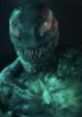 Toxin-inspired creature with a menacing expression and green, textured skin, embodying horror and fantasy elements.