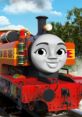 Nia from Thomas & Friends, vibrant red engine with a cheerful expression, set against a bright blue sky and lush greenery.