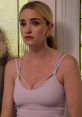 Brianne Howey displays a concerned expression, wearing a stylish lavender top, highlighting her versatile acting skills.