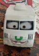 Toy figure of Arvy from Cars, featuring a smiling face, big eyes, and a white color scheme, perfect for collectors and kids.