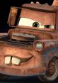 Rusty tow truck character from "Cars 2" with a cheeky grin, showcasing his signature personality and charm.