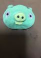Cute green plush pig toy with big eyes, representing the Normal Minion Pig Error from popular mobile games.