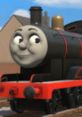 Brandon the black OC engine smiles cheerfully, showcasing his sleek design and vibrant colors against a sunny backdrop.
