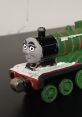 Cute green train toy inspired by Lucy & Bethany as Katie Jones from Bruno & Friends, featuring a playful face design.