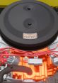 Close-up of a 426 HEMI V8 engine showcasing its orange components and intricate wiring details for automotive enthusiasts.