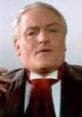 Declan, the master horror narrator, delivers chilling tales with a captivating expression and classic attire.