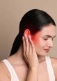 Woman experiencing ear pain, holding her ear in discomfort, indicating the effects of powerful ear-related issues.