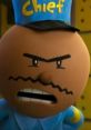 Chief from the Dog Man movie, with an intense expression, wearing a blue uniform and hat, showcasing his authoritative demeanor.