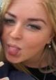 Cheerful girl playfully sticking out her tongue, showcasing a fun and lighthearted personality.