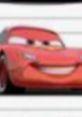 Lightning McQueen, the iconic red race car, showcases his signature smile and racing spirit in this vibrant scene.