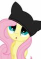 Fluttershy character with long pink mane, wearing a black cat hat, showcasing a cute and curious expression.