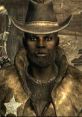 Lucas Simms, sheriff of Megaton in Fallout 3, wearing a cowboy hat and leather coat in a post-apocalyptic setting.