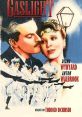 Diana Wynyard and Anton Walbrook in "Gaslight" (1940), surrounded by dancers, capturing classic cinematic romance.