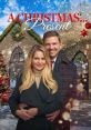 Couple joyfully posing in front of a decorated church for "A Christmas... Present" surrounded by festive winter scenery.