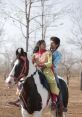A young couple joyfully rides a horse, reflecting the romance and passion seen in Sairat (2016).