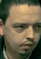 Close-up of a man with short hair, serious expression, highlighting intense gaze and features. Relevant to Andreas_usw_GER topic.