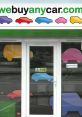 Bright storefront of WeBuyAnyCar featuring colorful car graphics, showcasing the brand's welcoming atmosphere for customers.