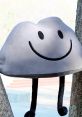 Smiling rock plush toy hanging between two trees, inspired by Rocky from BFB, showcasing a cheerful expression.