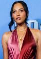 Ayesha Curry showcasing a stunning burgundy dress at a red carpet event, highlighting her elegant style and beauty.