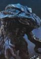 Orga G2K stands menacingly, showcasing its blue, textured skin and formidable claws in a dark, moody atmosphere.
