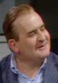 Cheerful character from "Porridge," showcasing a lighthearted moment with a memorable smile and engaging expression.