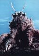 Close-up of Ganimes, a monstrous crab-like creature, showcasing its intimidating features and iconic design from classic cinema.