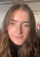 Close-up of Cassidy McEown with long hair, natural makeup, and a soft expression, showcasing her vibrant personality.