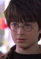 Young Harry Potter gazes thoughtfully with his signature round glasses and tousled hair, embodying the spirit of magic and wonder.