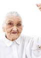 Empowered elderly woman smiles and raises her arm confidently, embodying strength and resilience. Perfect for "Struggling Gramma.