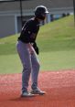 Dean Baseball 2026 player on the field, poised and ready in black uniform, showcasing athleticism and team spirit.