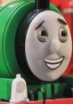 Percy the Small Engine smiles brightly, showcasing vibrant green detailing in this playful Robot Chicken portrayal.
