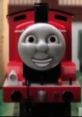 James the Red Engine from Robot Chicken, smiling brightly in a vibrant landscape, showcasing his playful character.