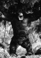 King Kong from the 1933 classic, roaring fiercely in a dramatic jungle setting, showcasing the iconic creature's power.
