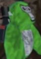 Bright green avatar in a playful pose, reminiscent of J3vu trolling vibes in a gaming environment.