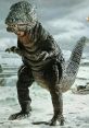 Gorosaurus, the iconic kaiju, stands menacingly in a sandy environment, showcasing its textured skin and fierce stance.
