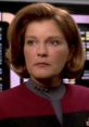 Captain Kathryn Janeway in friendly mode, showcasing her leadership and determination in Star Trek: Voyager's iconic uniform.