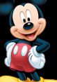 Mickey Mouse smiling and posing playfully, iconic cartoon character with large ears and red shorts, perfect for kids' themes.