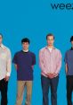 Weezer band members in casual attire, showcasing the iconic Blue Album style associated with "Buddy Holly.