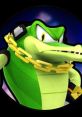 Vector the Crocodile flaunts a fierce expression, wearing a gold chain and headphones, embodying strong character design.