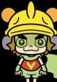 9-Volt (Español) character in a bright costume with a cheerful expression, wearing a yellow helmet and cape.