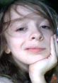 Cute child with a thoughtful expression, embodying the spirit of "Auryn (AKA My Voice)" and creativity.