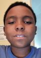 A young boy smiles confidently, showcasing his personality and the power of expressing his voice.
