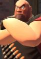 Heavy character from Team Fortress 2, showcasing his muscular build and intense expression, armed with ammunition belts.