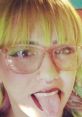 Playful expression with bright yellow-green hair and stylish glasses, showcasing a fun and vibrant personality.
