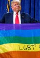 Donald Trump holds a rainbow flag with "LGBT's" written, emphasizing diversity and inclusion in a political setting.