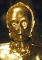 Close-up of C-3PO, the iconic gold protocol droid from Star Wars, showcasing its distinct features and metallic finish.