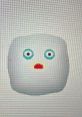 Cute cartoon character with a surprised expression, featuring blue eyes and a round, white shape. Perfect for playful themes.