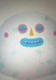 Colorful cartoon character with a round face, playful expressions, and polka dots, highlighting creativity and whimsy.